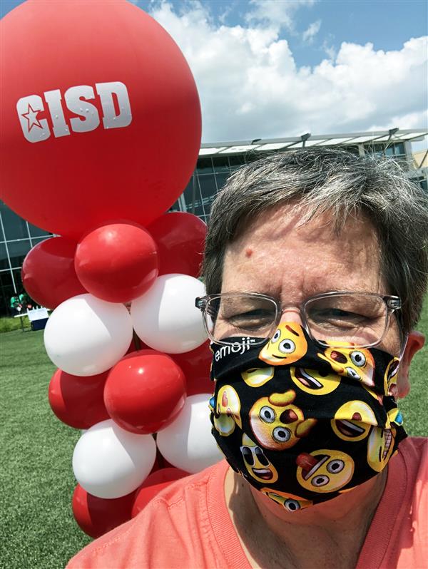 Becky Poston posing with a balloon 